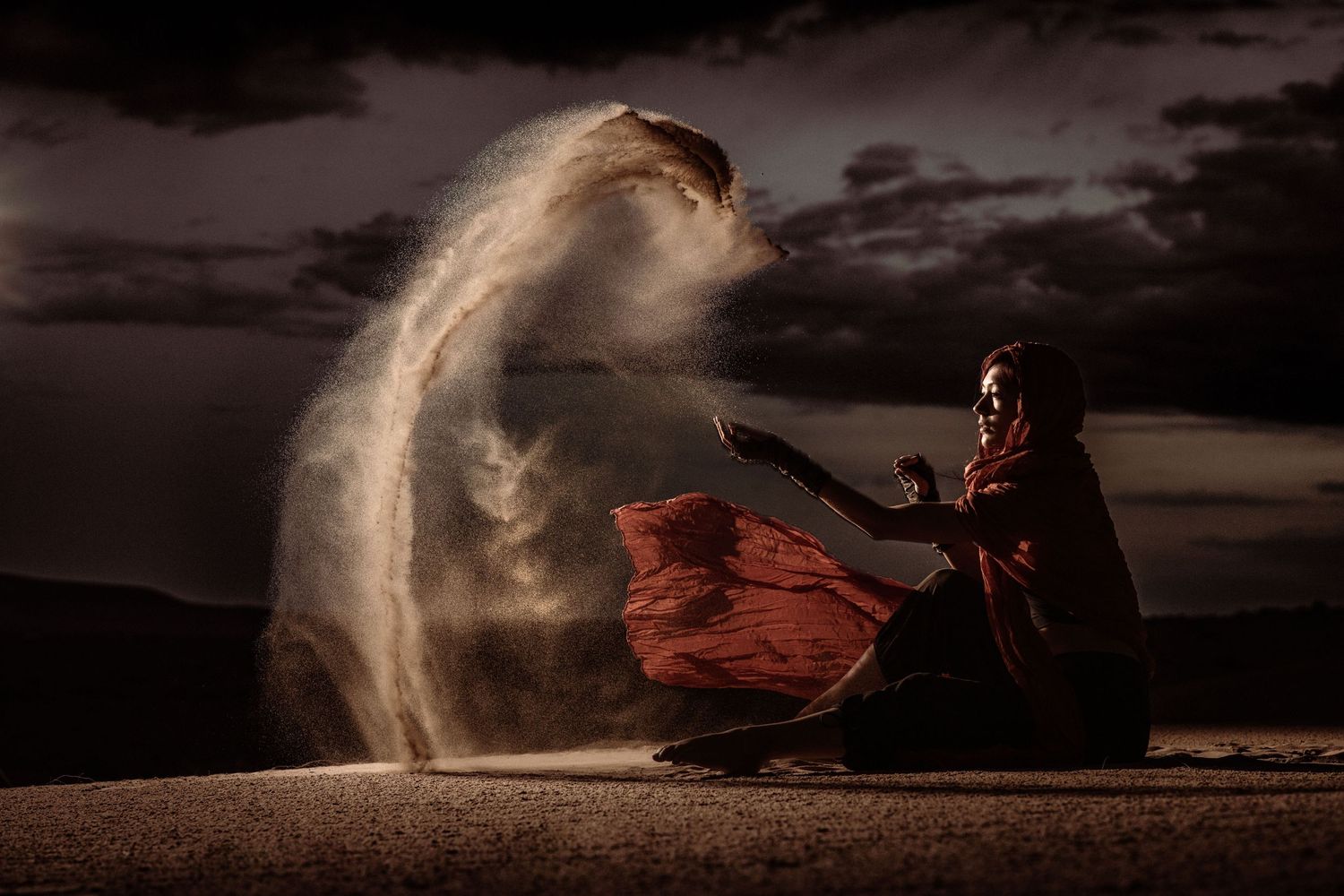 Beautiful outdoor editorial photography; woman on a sand dune at night; Clarissa Anello