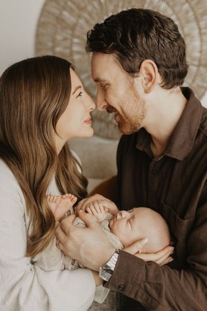 A romantic couple shares intimate moments in a series of candid photos showing their affection and closeness.