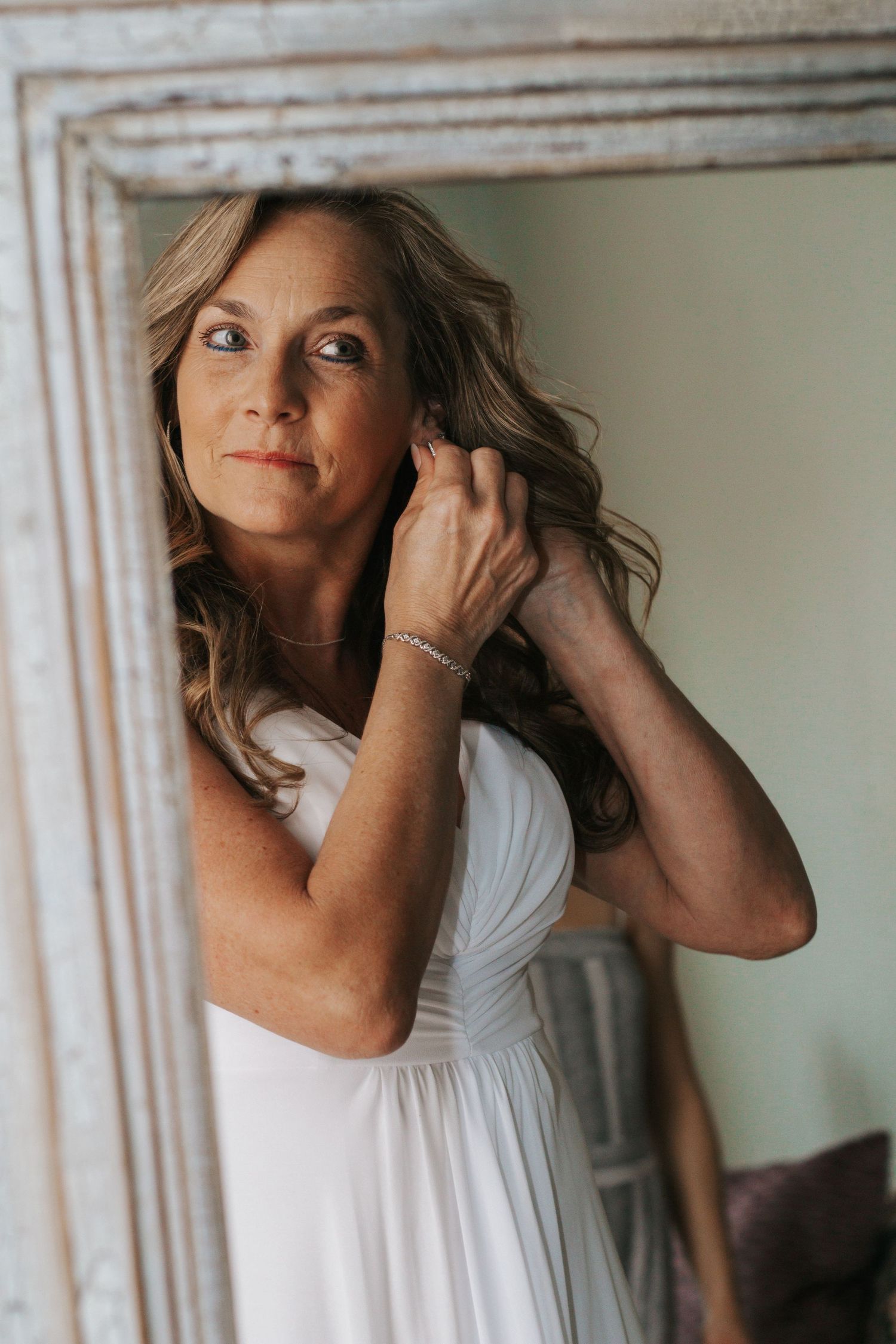 Bride posing elegantly in a mirror at a small Kennewick, Washington wedding.