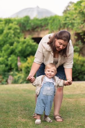 A mother and son walking and smiling at Valley Gardens Harrogate