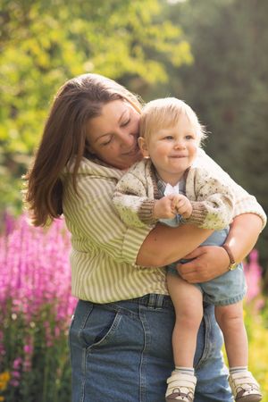 A mother and son playing and smiling