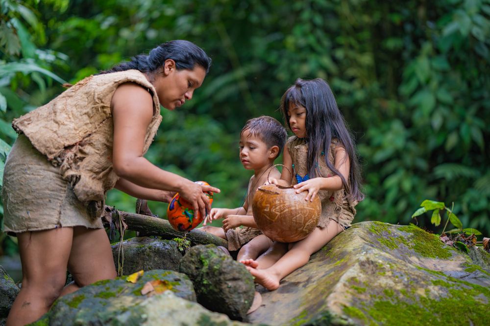 Natural stone formations and rocks surrounded by lush tropical greenery.