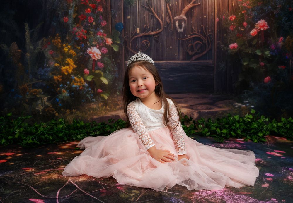 Magical princess portrait in pink dress against enchanted garden setting.