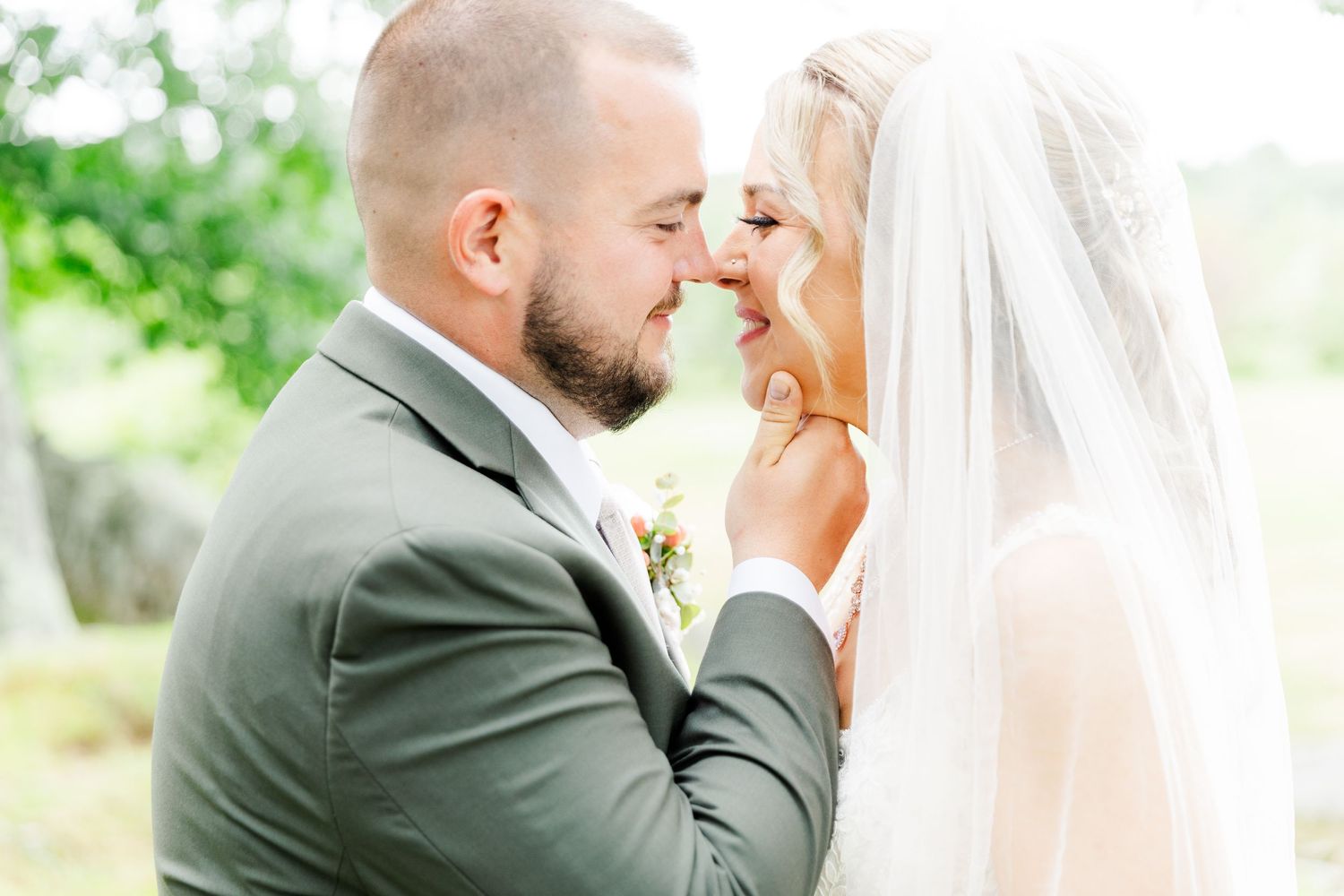 An intimate moment shared between newlyweds during their outdoor wedding celebration.
