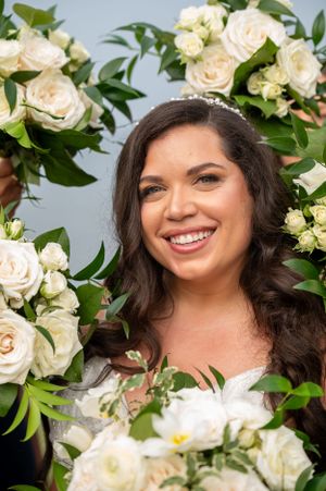 A wedding scene with white roses and greenery decorations.