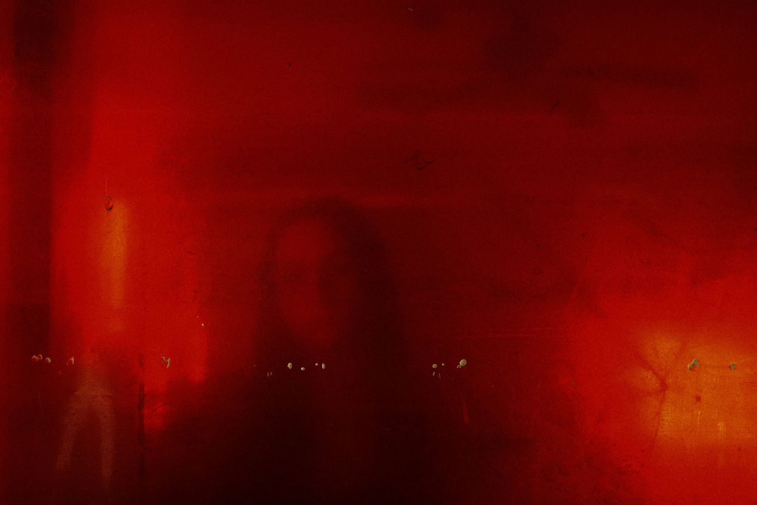 abstract soft focus portrait of a woman in red