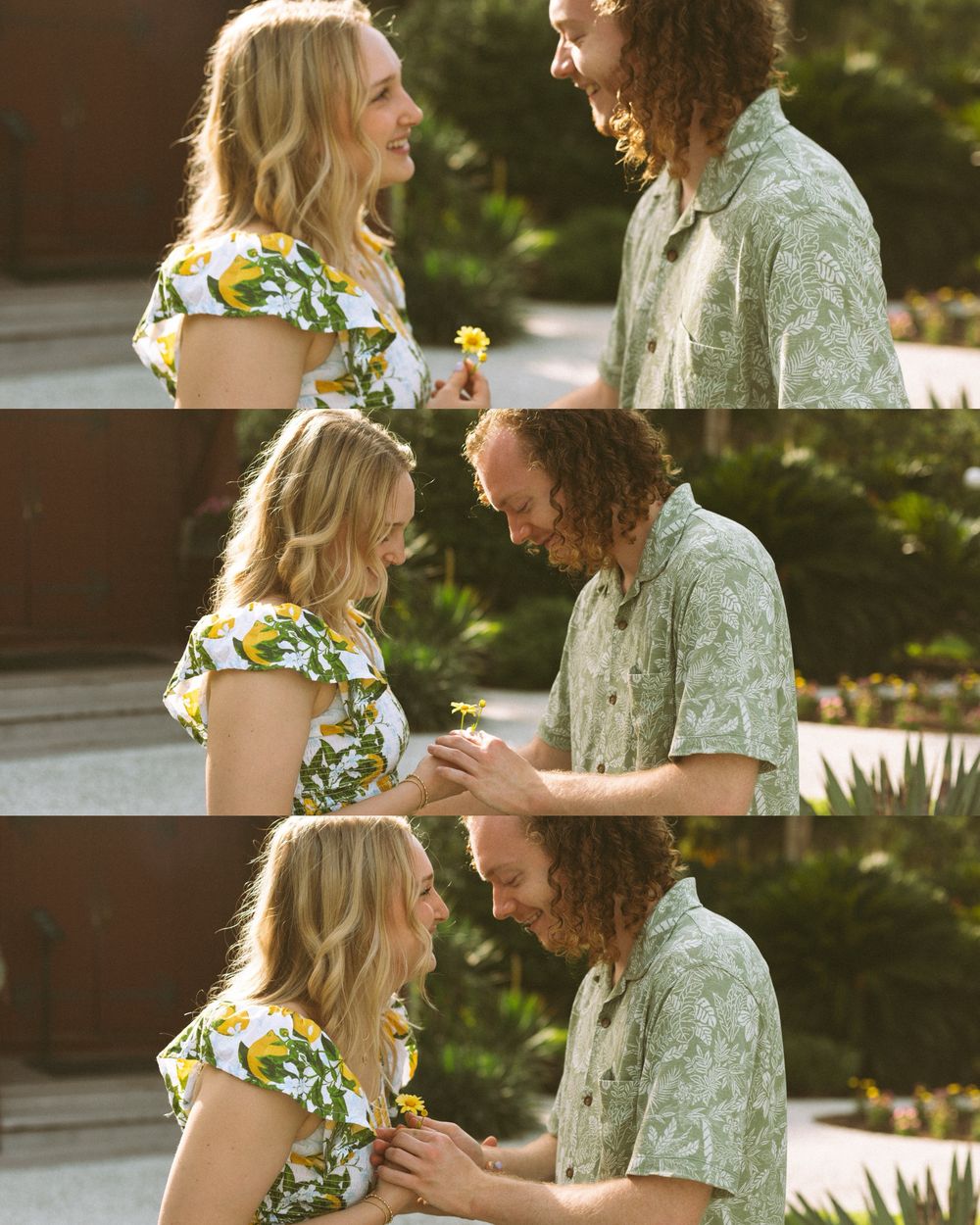 Two people share a romantic moment outdoors while holding a yellow flower in summer golden light.