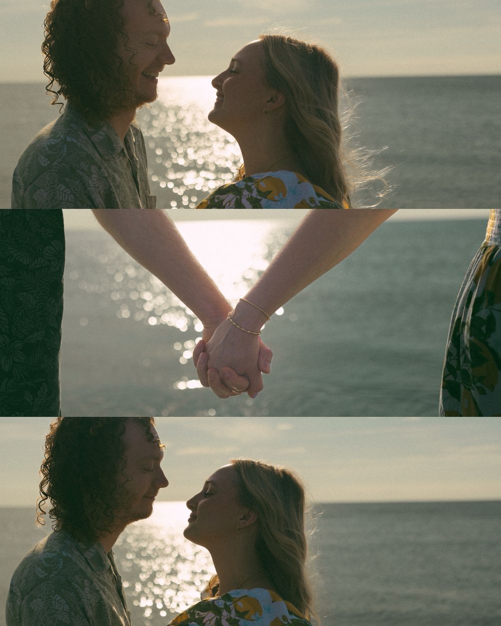 A couple shares an intimate moment by the ocean at sunset, holding hands as sunlight sparkles on the water.