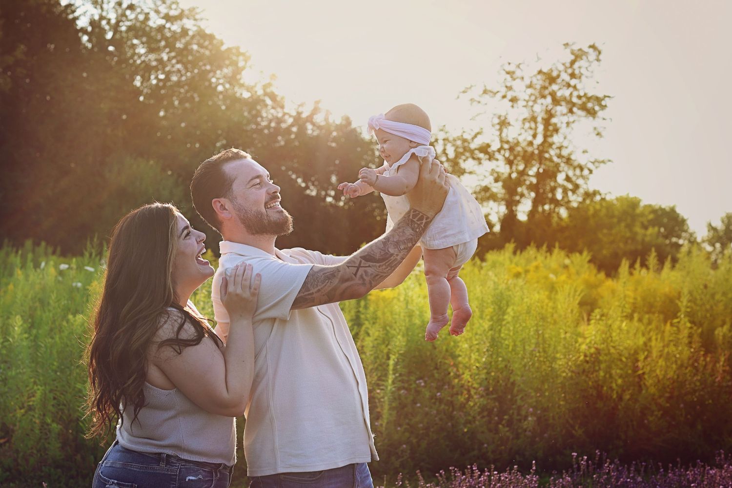 Joyful moment captured in a sunlit meadow during golden hour.
