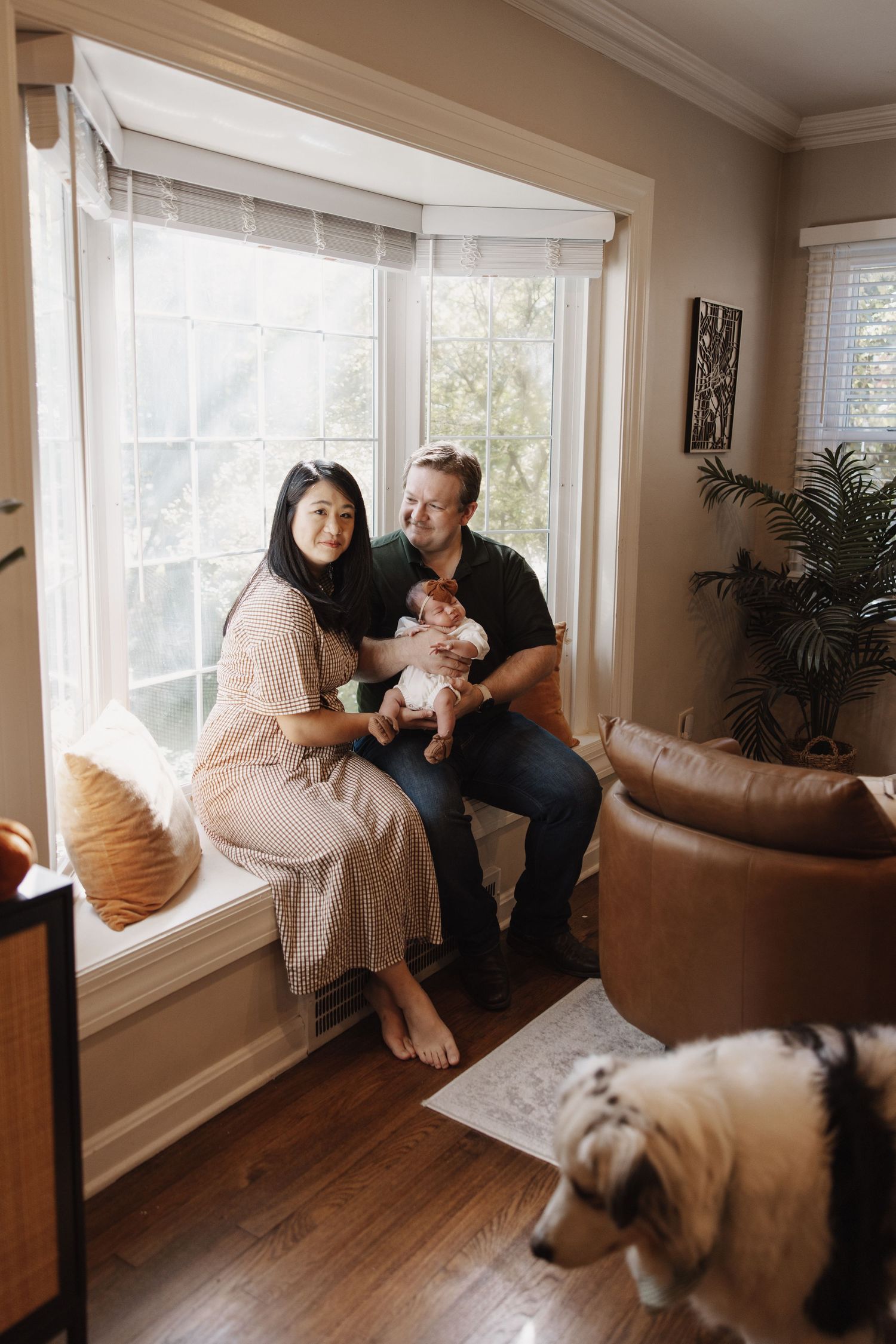 Candid beautiful at home photography photo newborn session baby in nursery with biracial couple, Asian mother who is a doctor.
