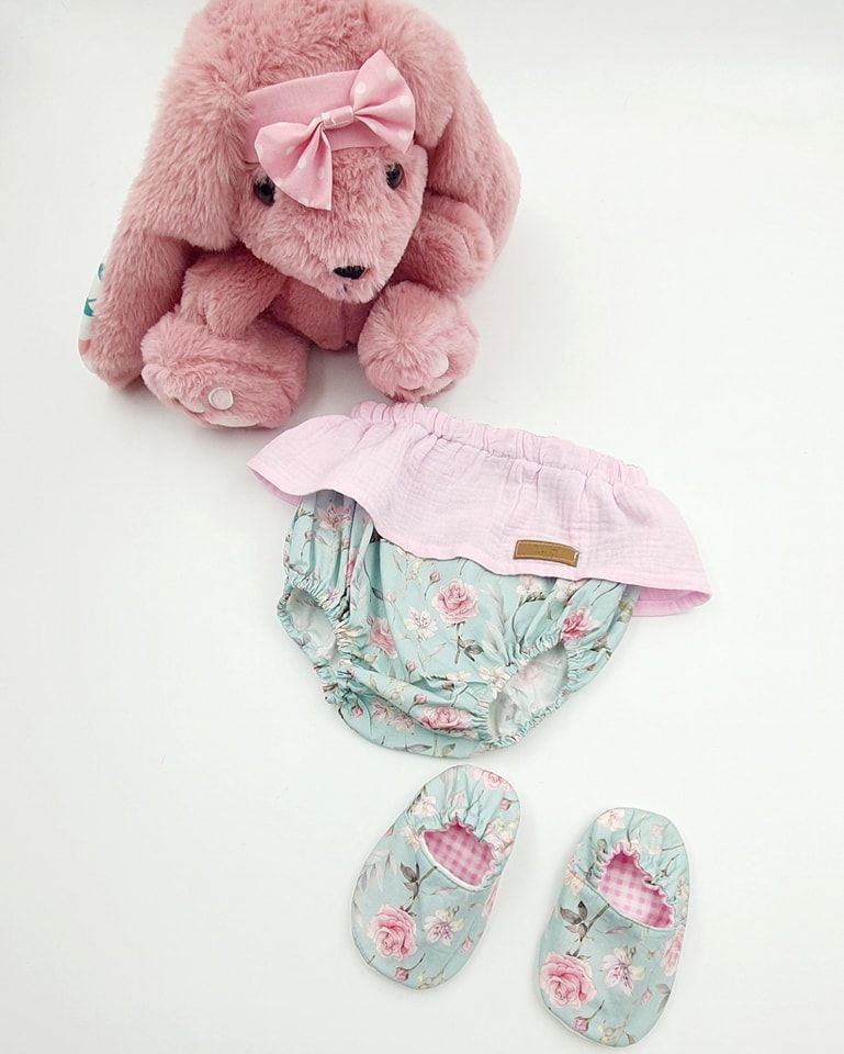 Pink plush bunny with mint floral baby clothing set and matching booties.