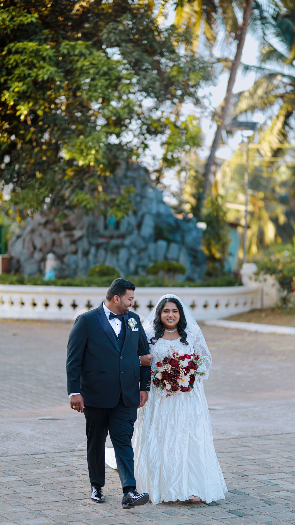 Bride and groom walking together outdoors after their wedding ceremony