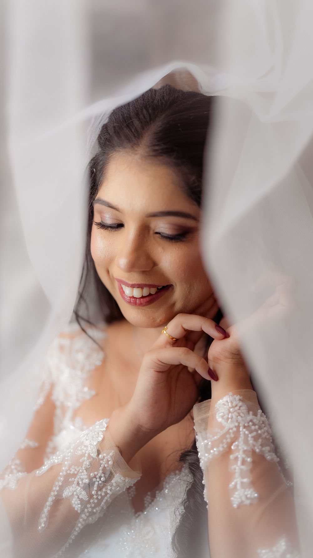 Bride smiling in a close-up wedding portrait
