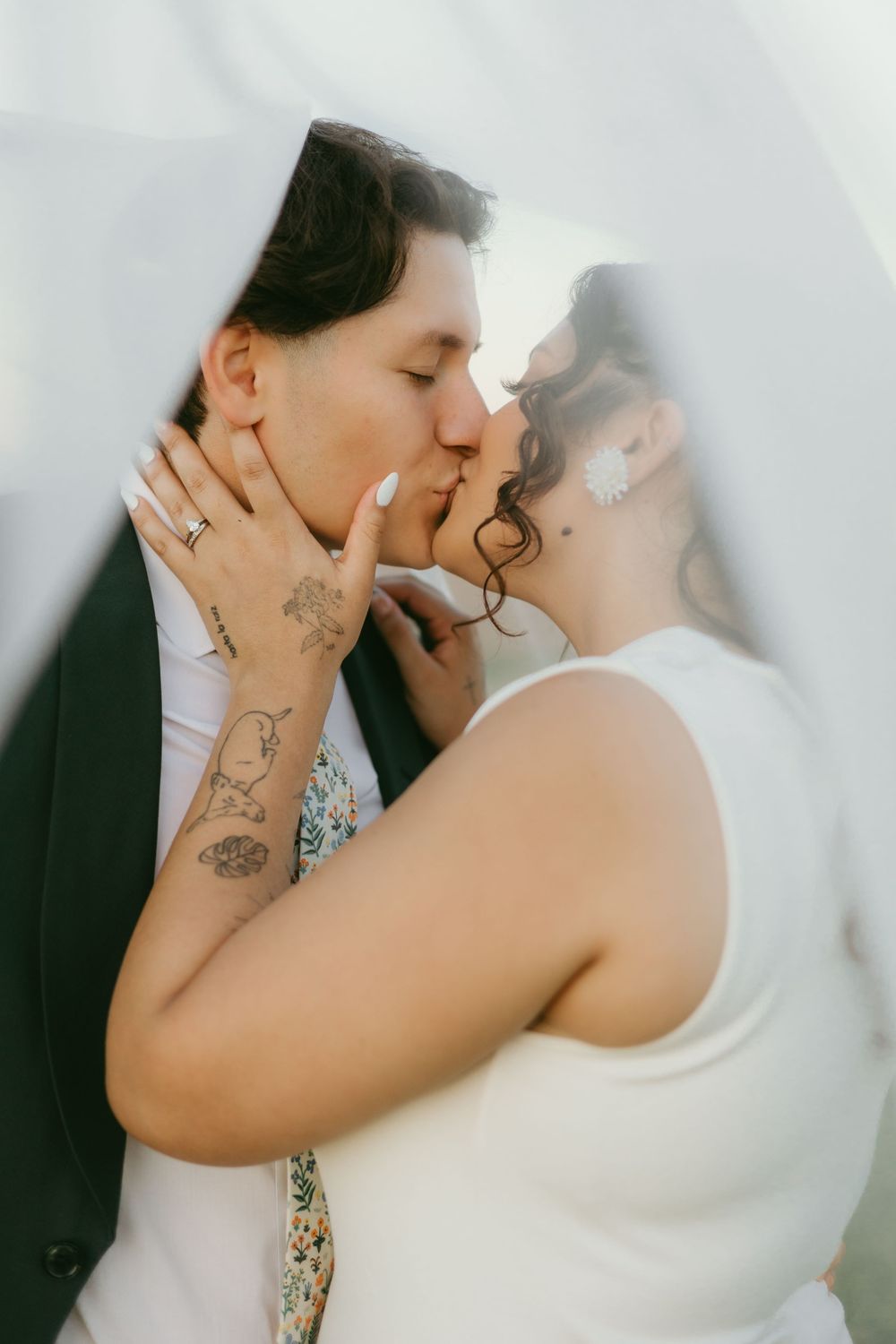 A romantic series of wedding photos showing a couple sharing intimate kisses in formal attire.