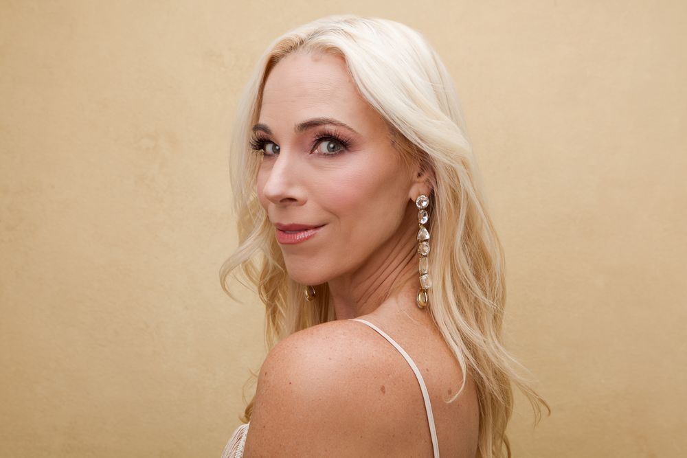 Glamorous studio portraits with soft lighting showcasing elegant evening wear and delicate jewelry.