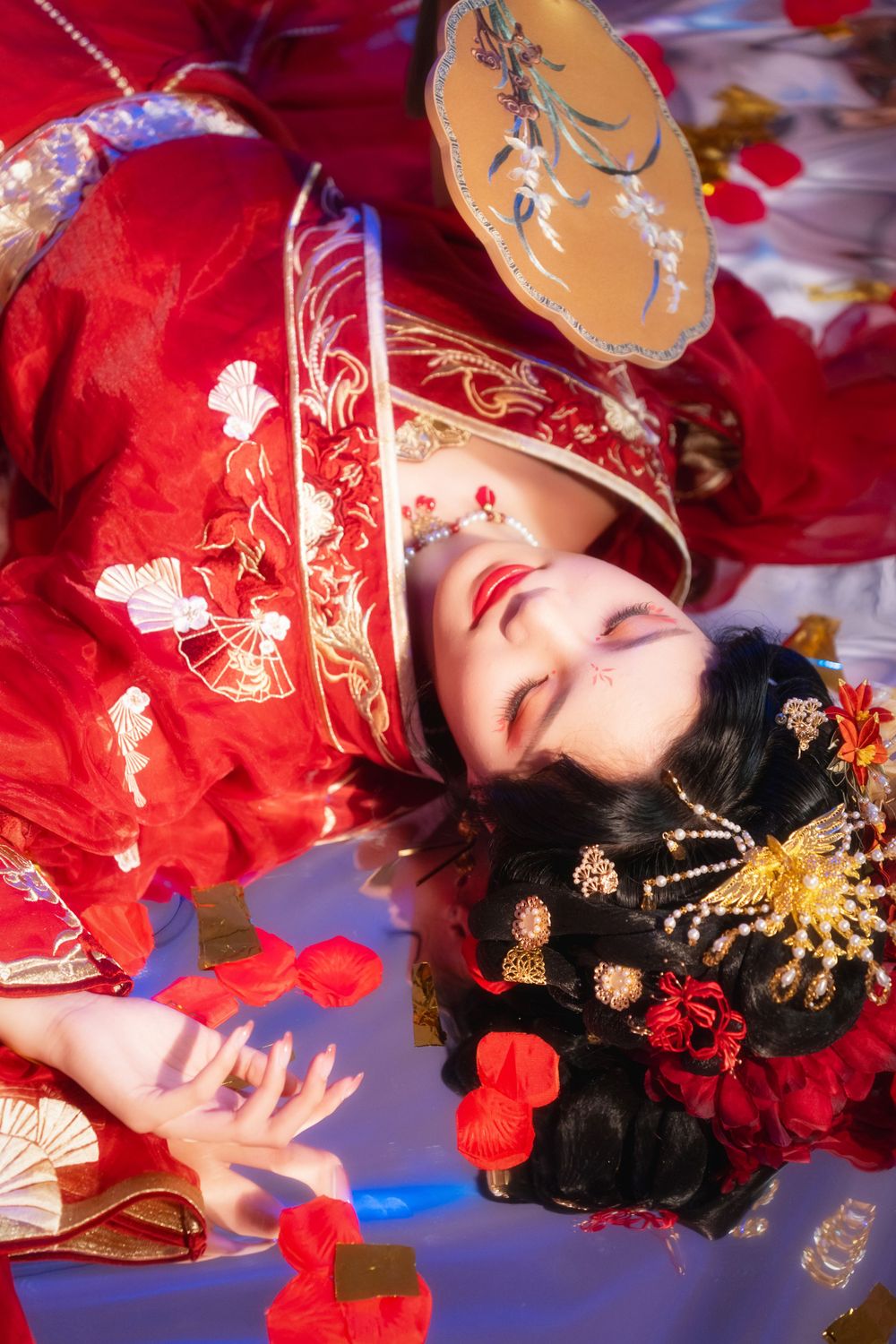 Alluring red spider lily Hanfu portrait with soft lighting, red candles, and a mirrored floor, by Imagine Image Studio.