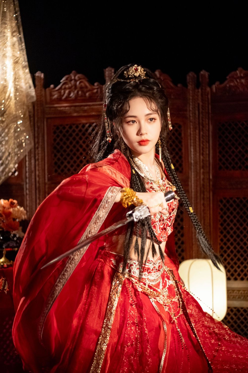 Dynamic photo of a beautiful assassin in red Western Regions Hanfu dancing among gold, silver, and flowers. Studio shot by Imagine Image Stu