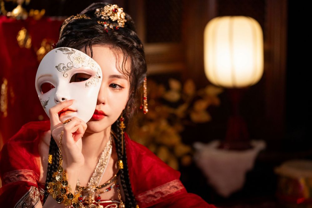 Dynamic photo of a beautiful assassin in red Western Regions Hanfu dancing among gold, silver, and flowers. Studio shot by Imagine Image Stu