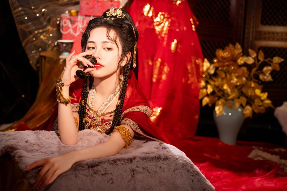 Dynamic photo of a beautiful assassin in red Western Regions Hanfu dancing among gold, silver, and flowers. Studio shot by Imagine Image Stu