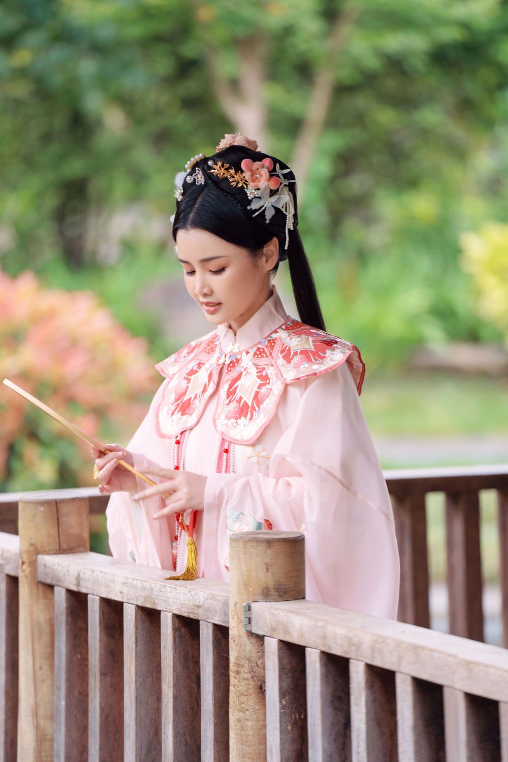 Adorable outdoor Hanfu photography featuring a strawberry bunny theme at Western Springs, captured by Imagine Image Studio.