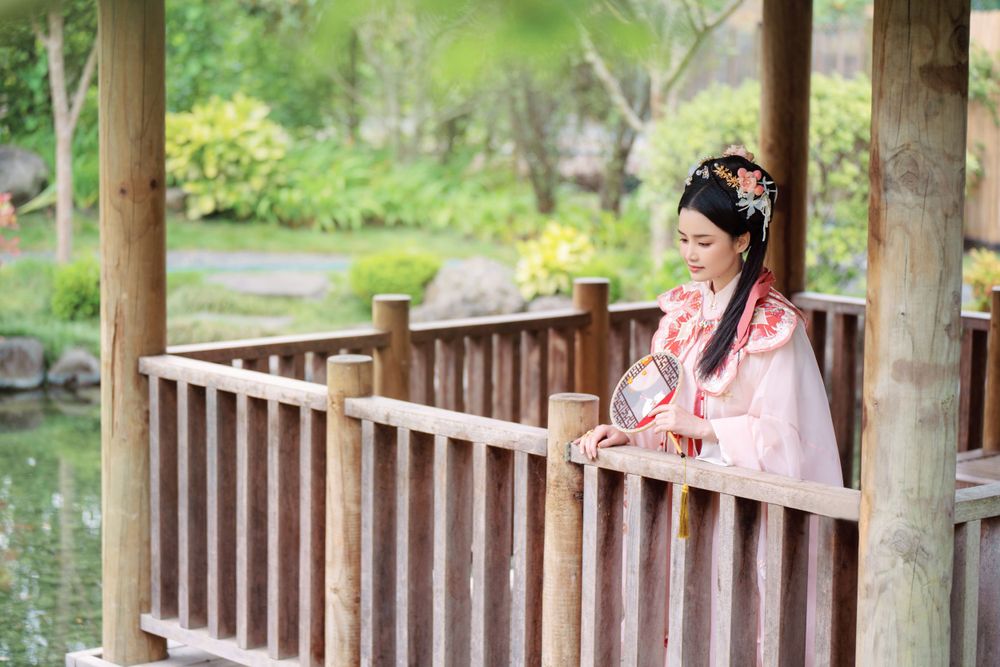 Adorable outdoor Hanfu photography featuring a strawberry bunny theme at Western Springs, captured by Imagine Image Studio.