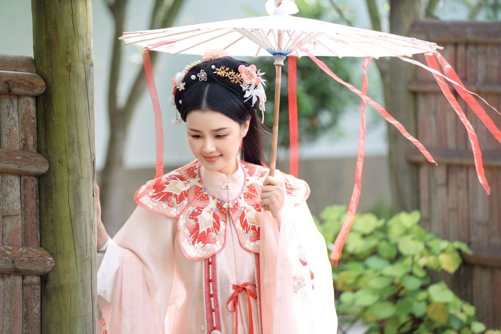 Adorable outdoor Hanfu photography featuring a strawberry bunny theme at Western Springs, captured by Imagine Image Studio.