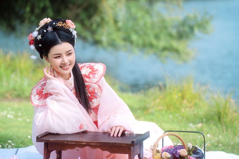 Natural and sweet solo photography in a strawberry rabbit Hanfu at Western Springs, by Imagine Image Studio Auckland.