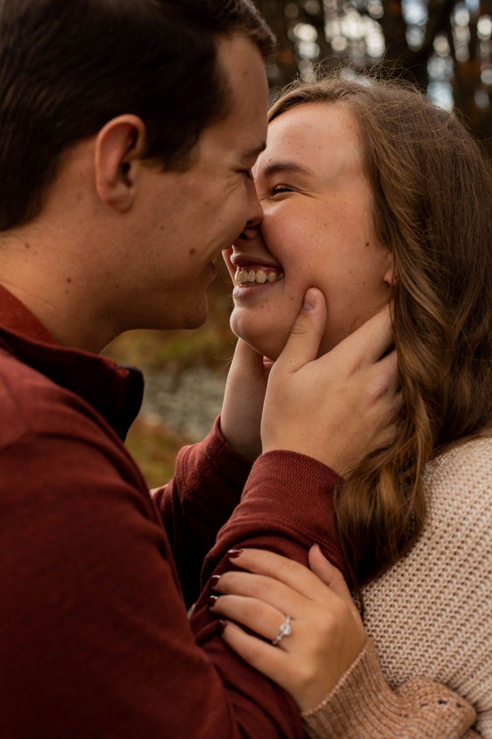A romantic close-up sequence of a couple sharing tender kisses against an autumn backdrop.