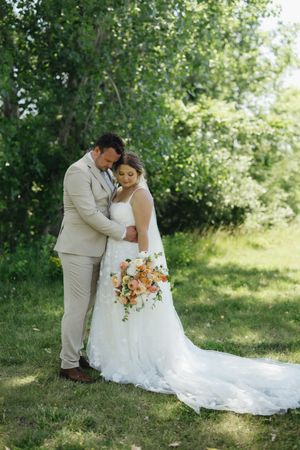 A couple shares tender moments in their wedding attire against a lush green outdoor backdrop in a series of romantic photos.