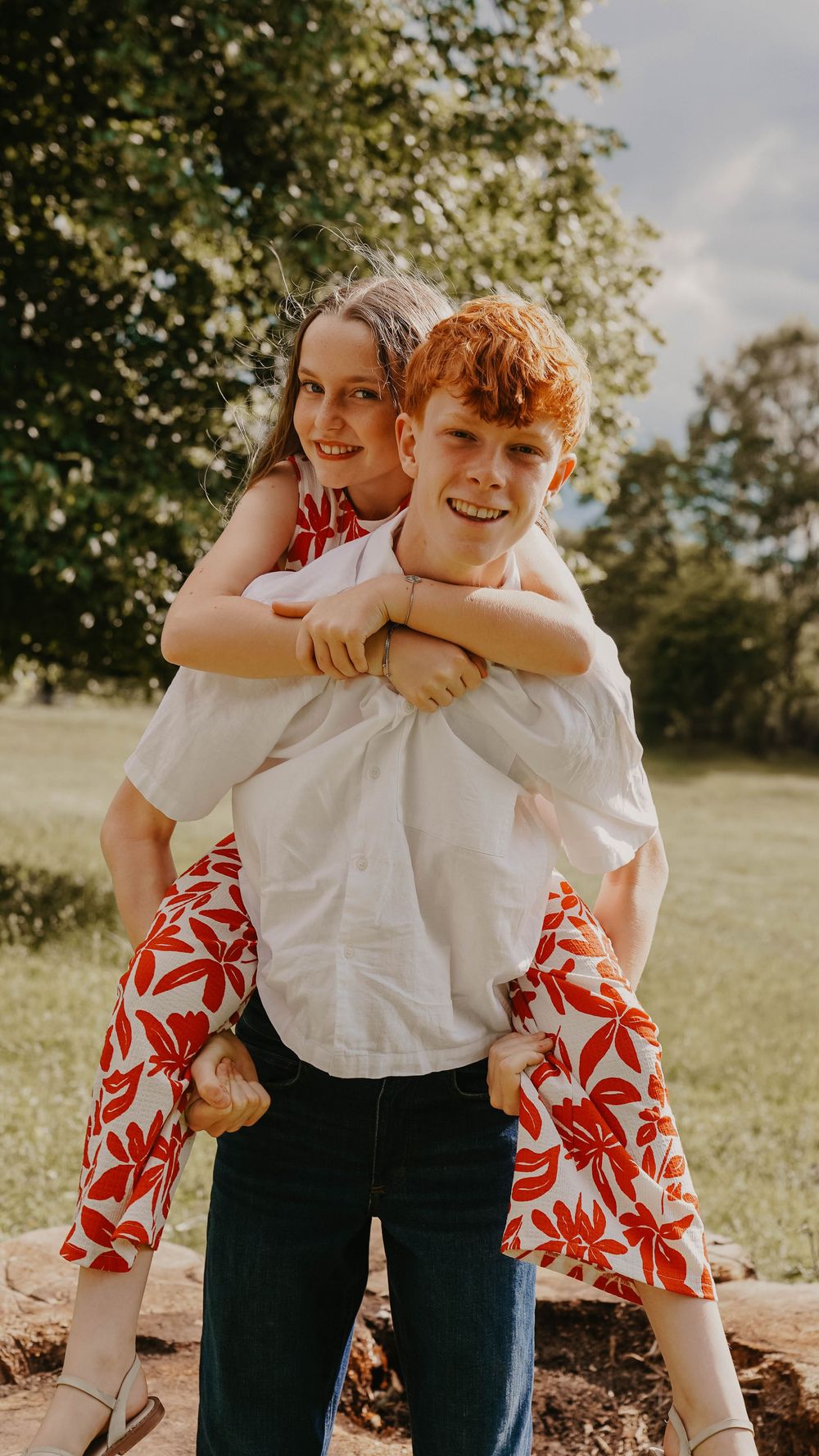 Playful outdoor photo series showing casual embraces and laughter.
