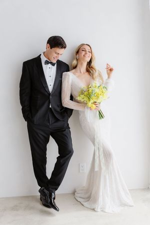 A modern minimalist wedding photo series showing a couple in formal attire against a white background.