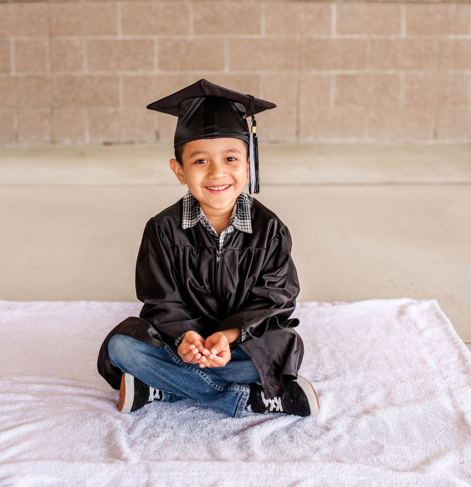 Preschool graduation photos with traditional cap and gown on light background.