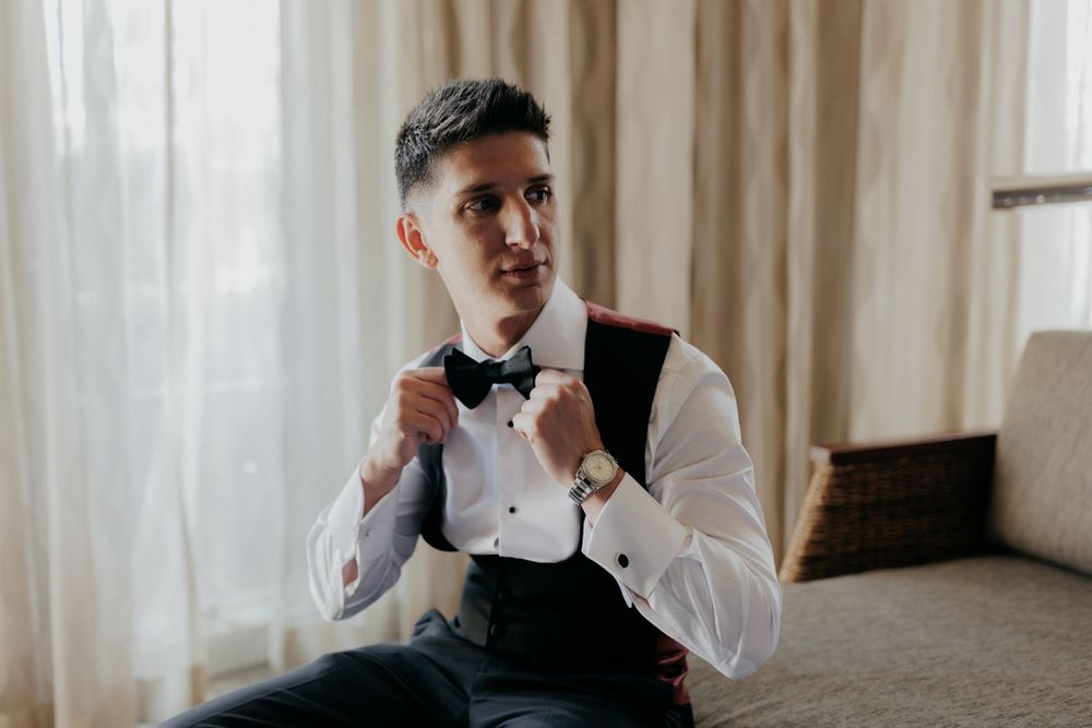 Getting ready scene showing formal attire preparation.