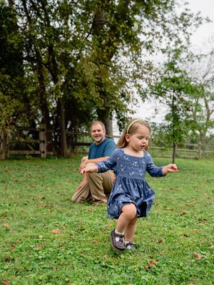 A series of candid moments captured in a grassy outdoor setting showing playful movements and expressions.