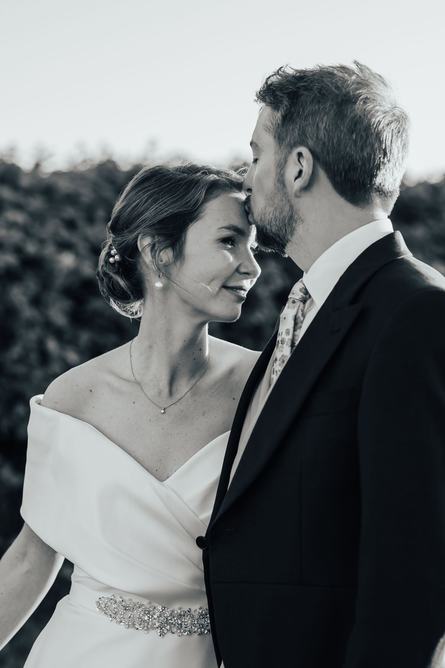 Grangefields Ashbourne, Elegant couples portrait. groom in cream suit. bride in romantic fitted ice gown. golden hour