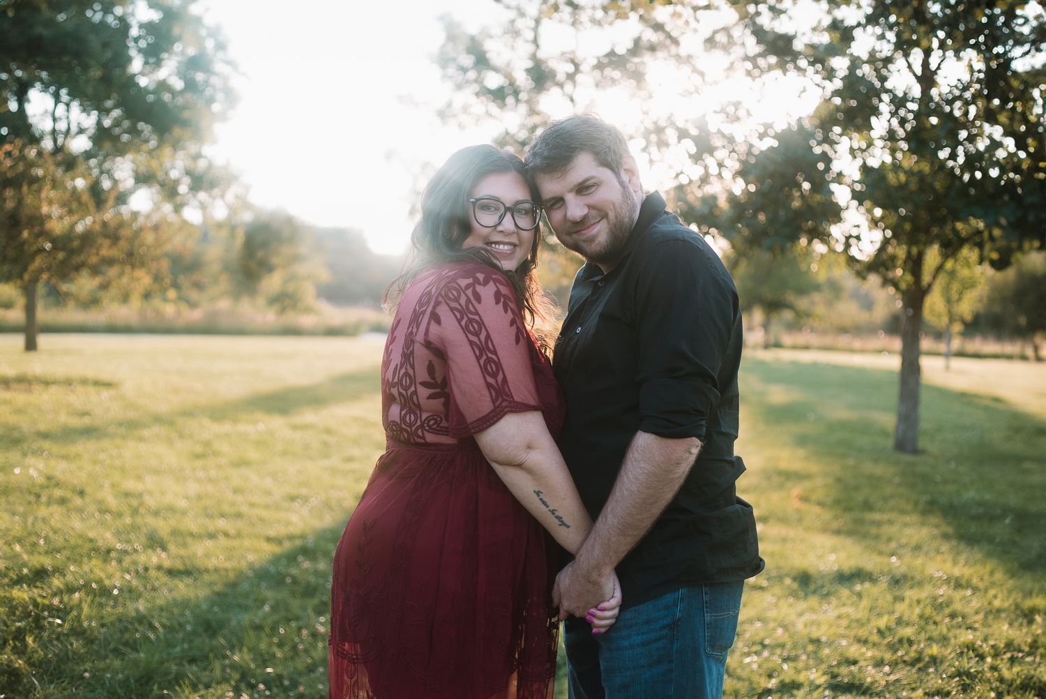 couple posing for engagement session in a forest, chicago area photographer