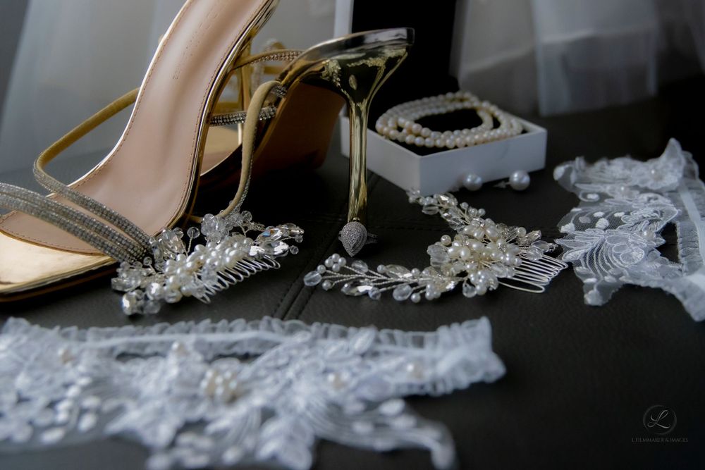 Delicate bridal accessories including crystal hairpieces and high heel shoes.