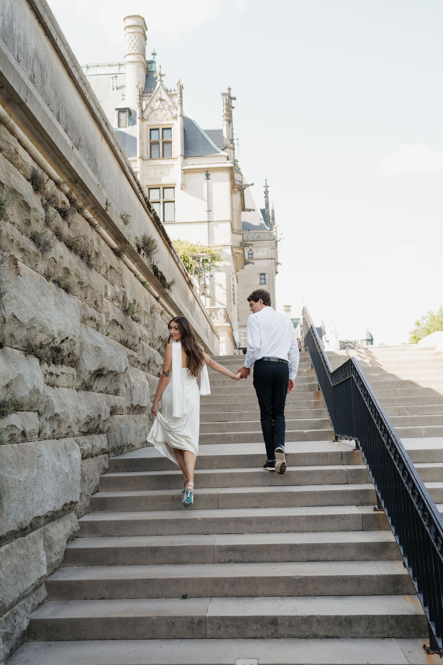 Romantic evening scene on illuminated steps with warm lighting and architectural details.