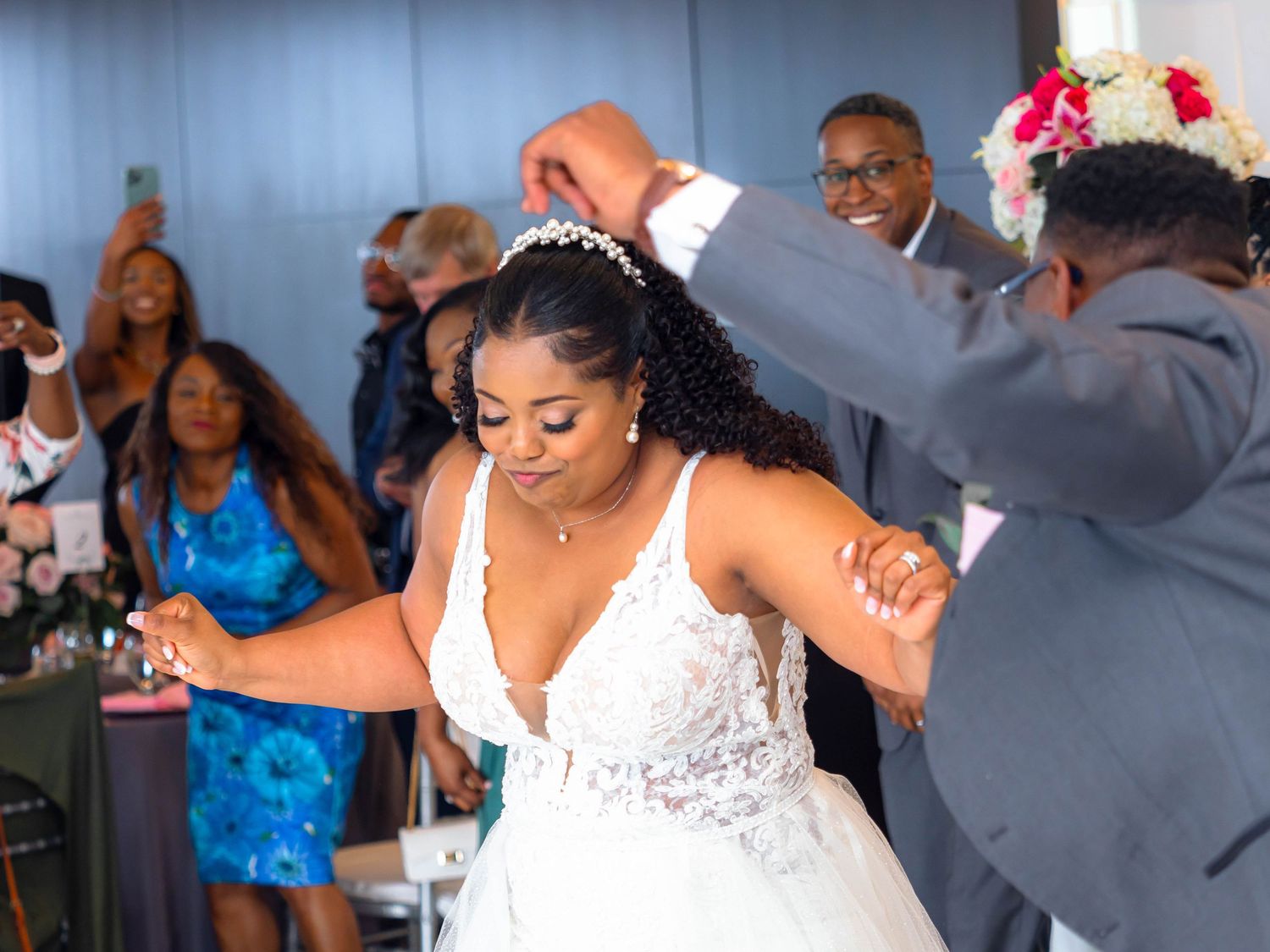 Happy newlyweds and guests dancing and celebrating during a joyful reception with multiple candid moments caught on camera.