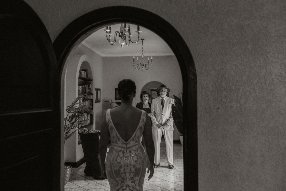 A black and white photo montage showing multiple wedding scenes with couples and formal attire in vintage style.