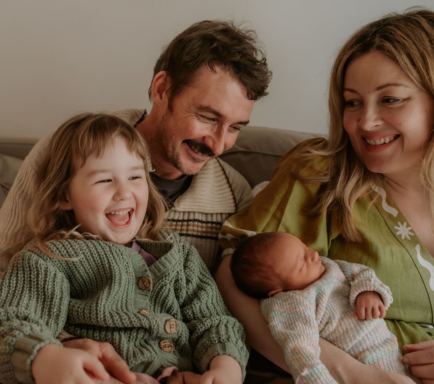A series of candid family photos showing joyful moments and laughter together on a couch.