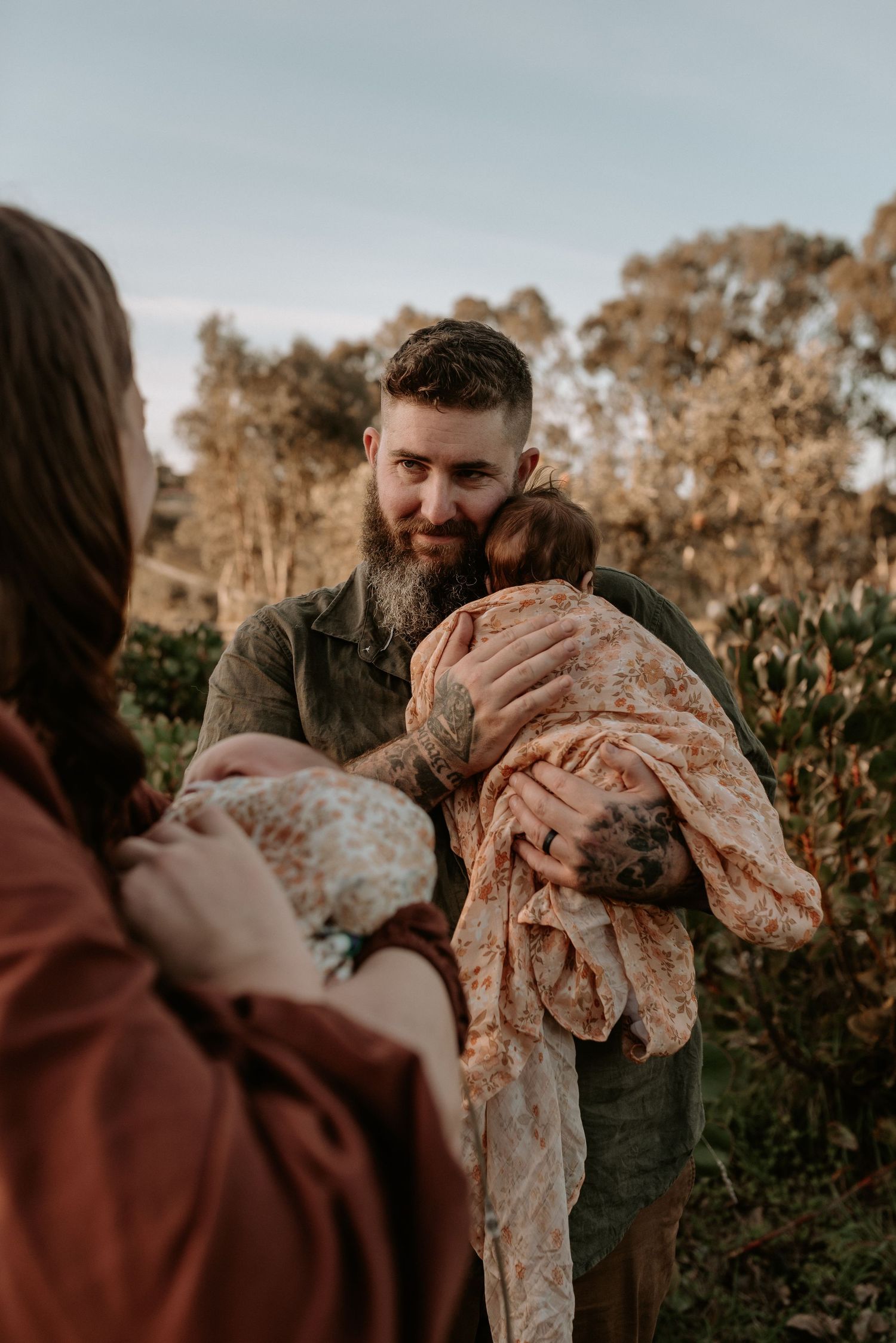 Sunset family photoshoot sequence in natural outdoor setting.