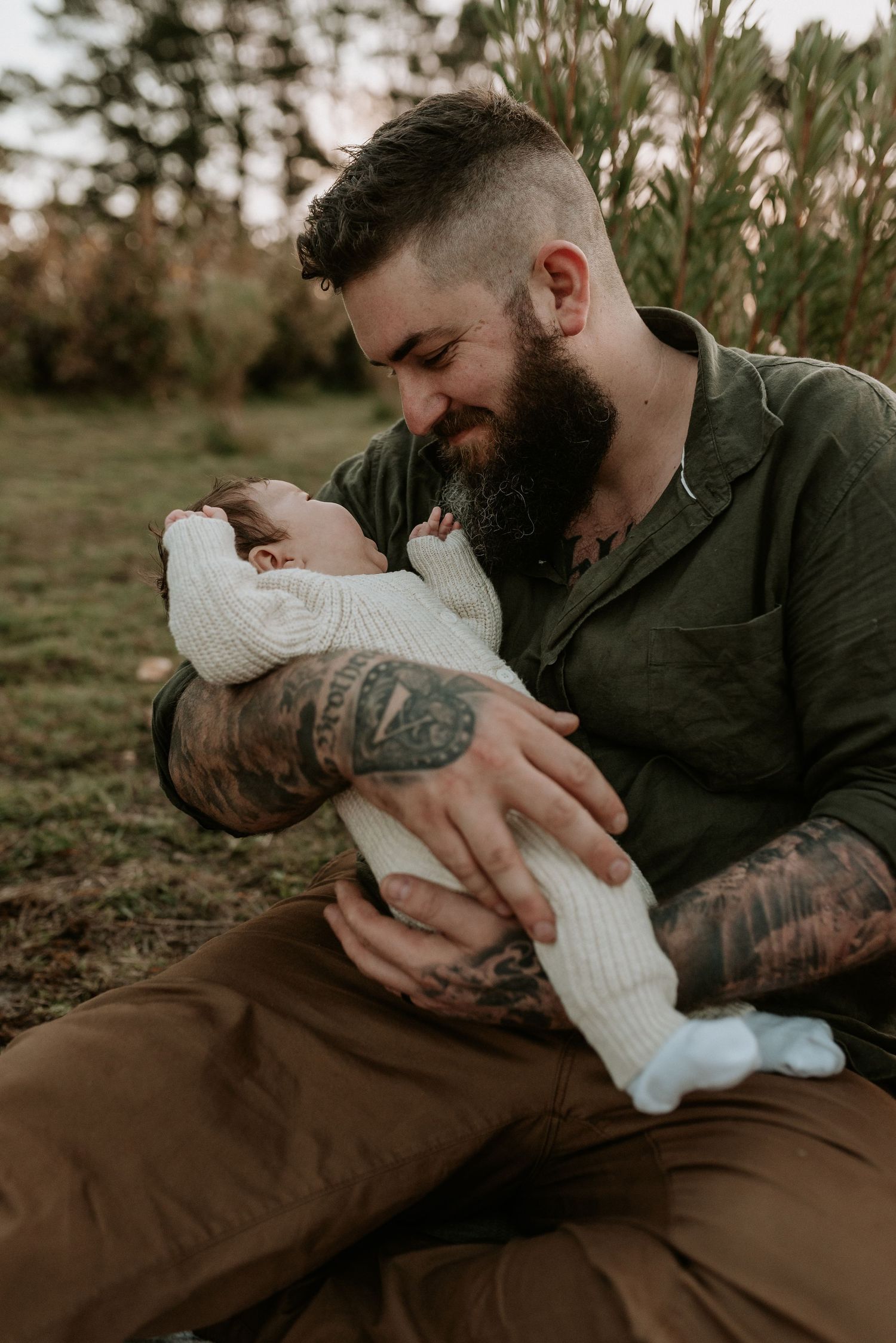 Tender moments between parent and baby wearing white knit clothing.