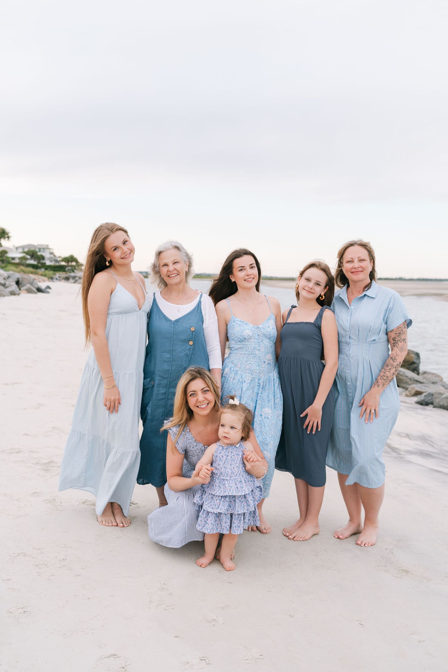 Large family gathered on Jekyll Island beach for a relaxed extended family photography session at golden hour.
