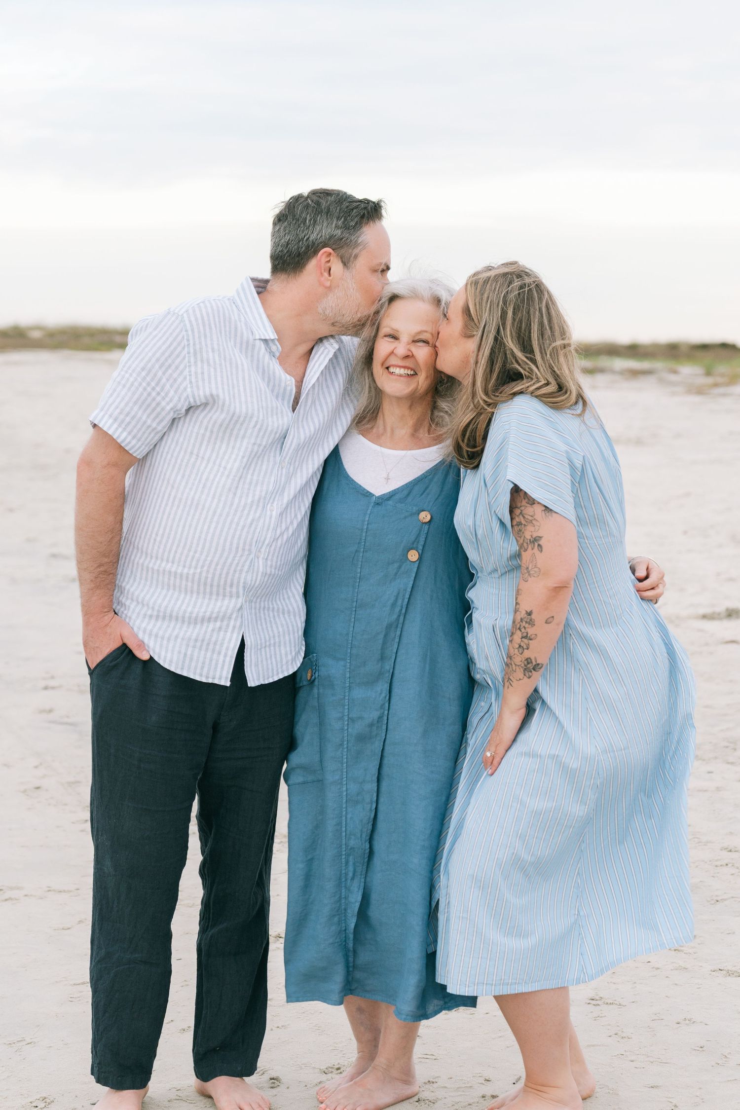 Extended family being together on the beach in the Golden Isles during a professional family photography session.
