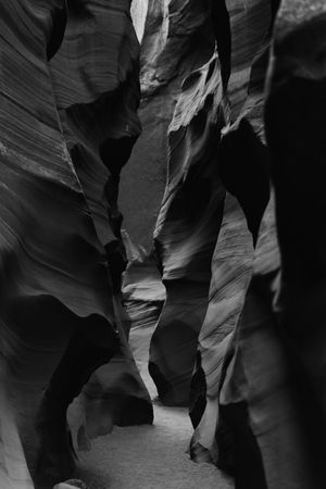 Dramatic black and white view of smooth curved walls in Antelope Canyon's narrow sandstone passages.