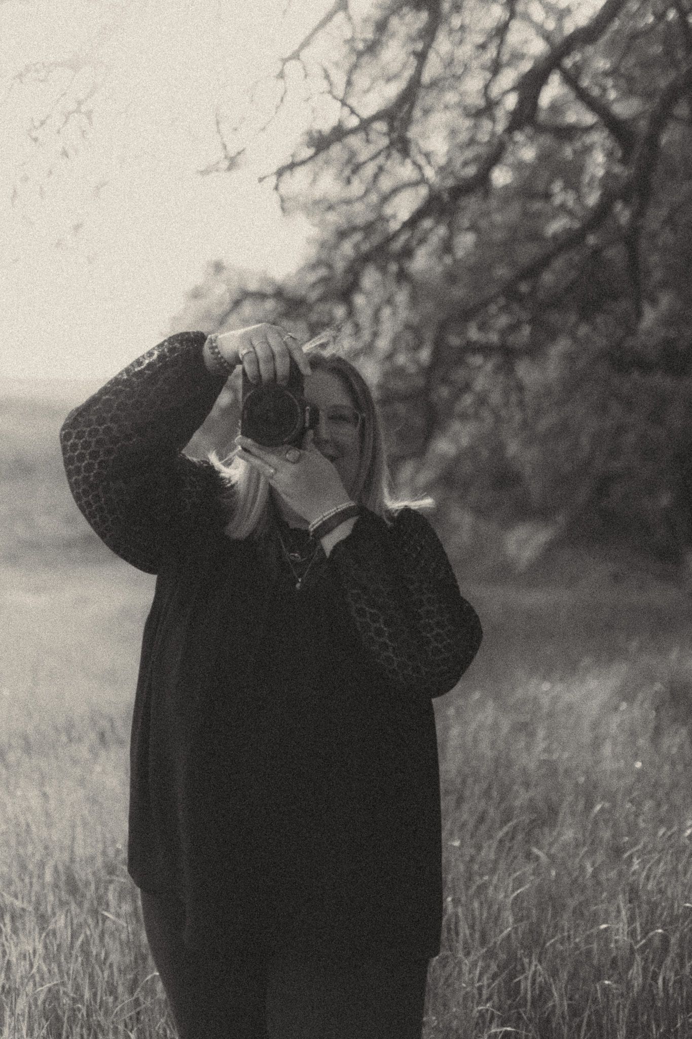 Intimate portraits with a horse against a natural backdrop in sepia tones.