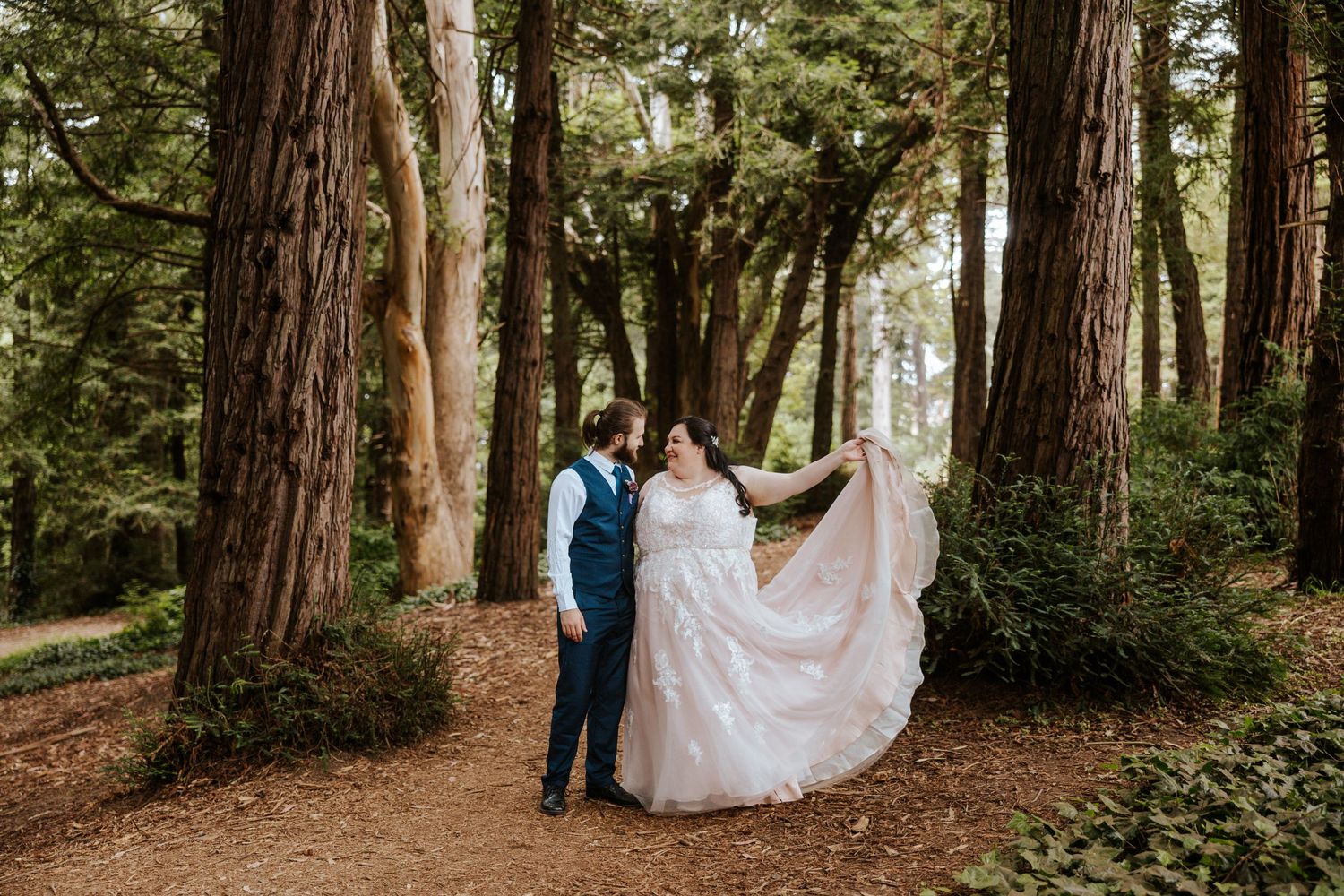 eloping couple standing in a redwood forest in golden gate park during san francisco elopement day