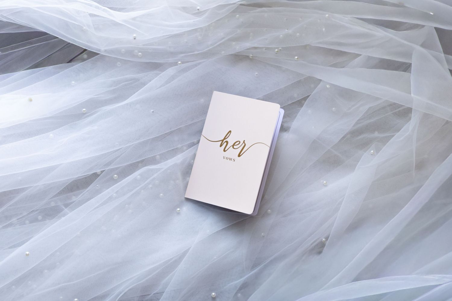 Delicate white tulle wedding veil fabric with elegant details.