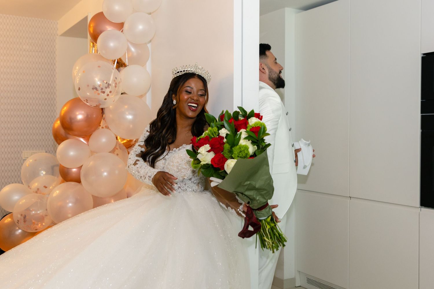 Wedding celebration with rose gold balloons and joyful moments.